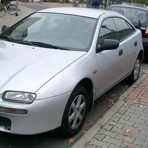 Продам оригинальный капот Mazda 323F